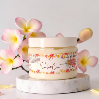 Luxury plumeria body and bath collection featuring body wash, body butter, scrub, bath salts, bath bombs and handmade soap for tropical spa self-care by Snuzhat Care