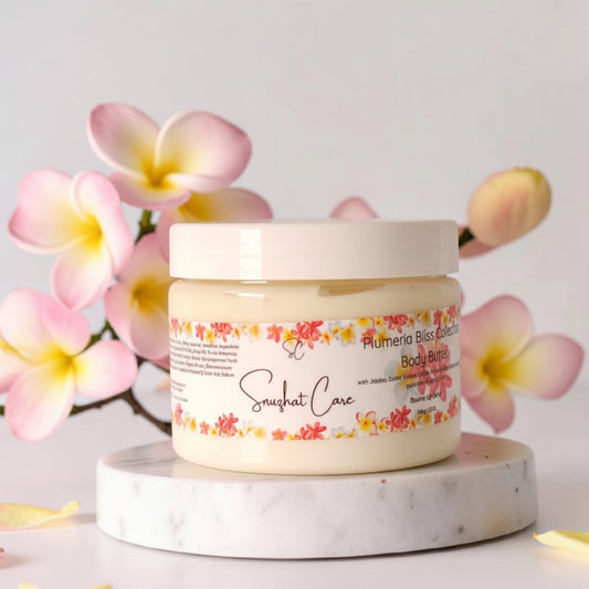Luxury plumeria body and bath collection featuring body wash, body butter, scrub, bath salts, bath bombs and handmade soap for tropical spa self-care by Snuzhat Care