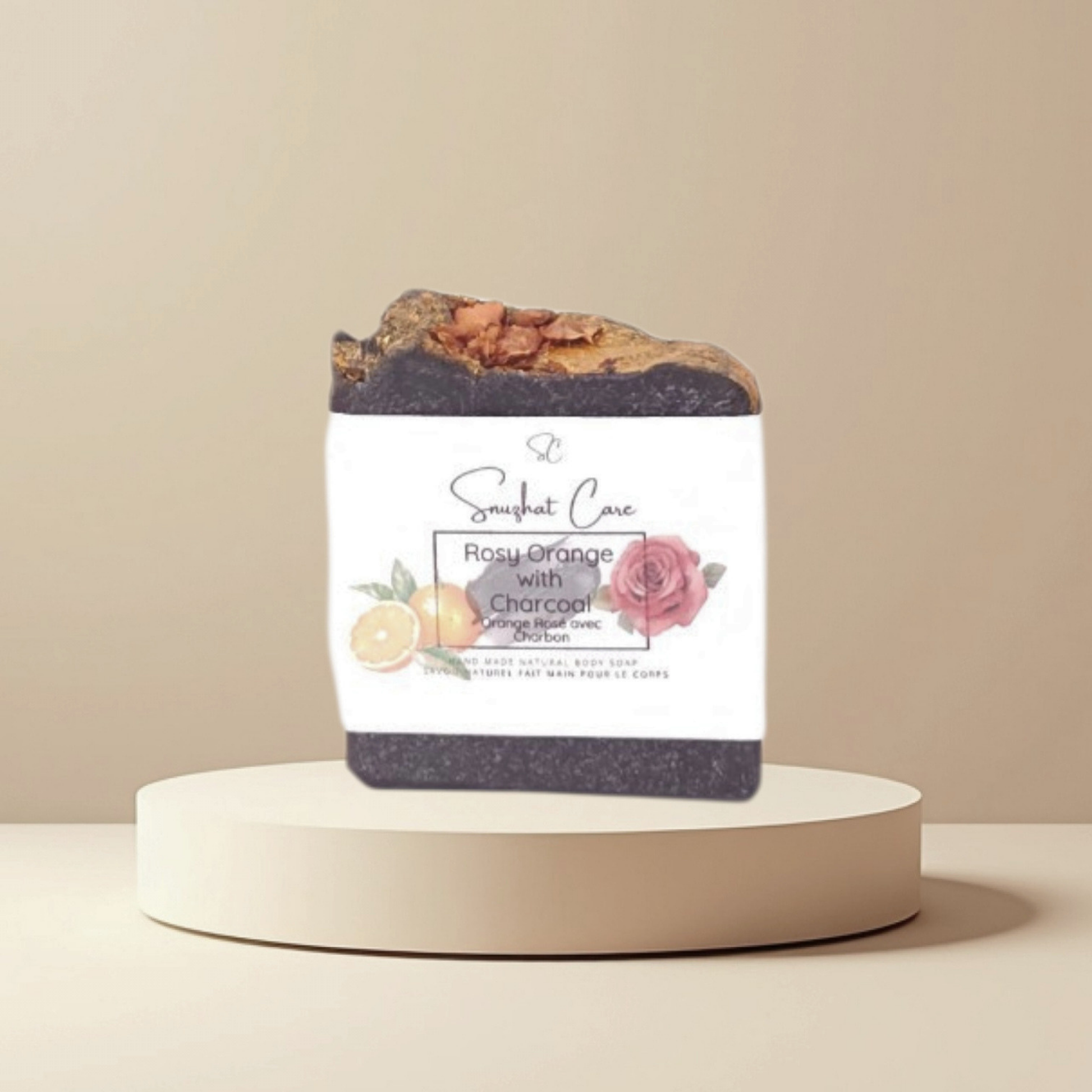 Handmade rosy orange charcoal soap bar with activated charcoal, rose petals, shea butter and citrus oils for refreshing botanical skincare by Snuzhat Care