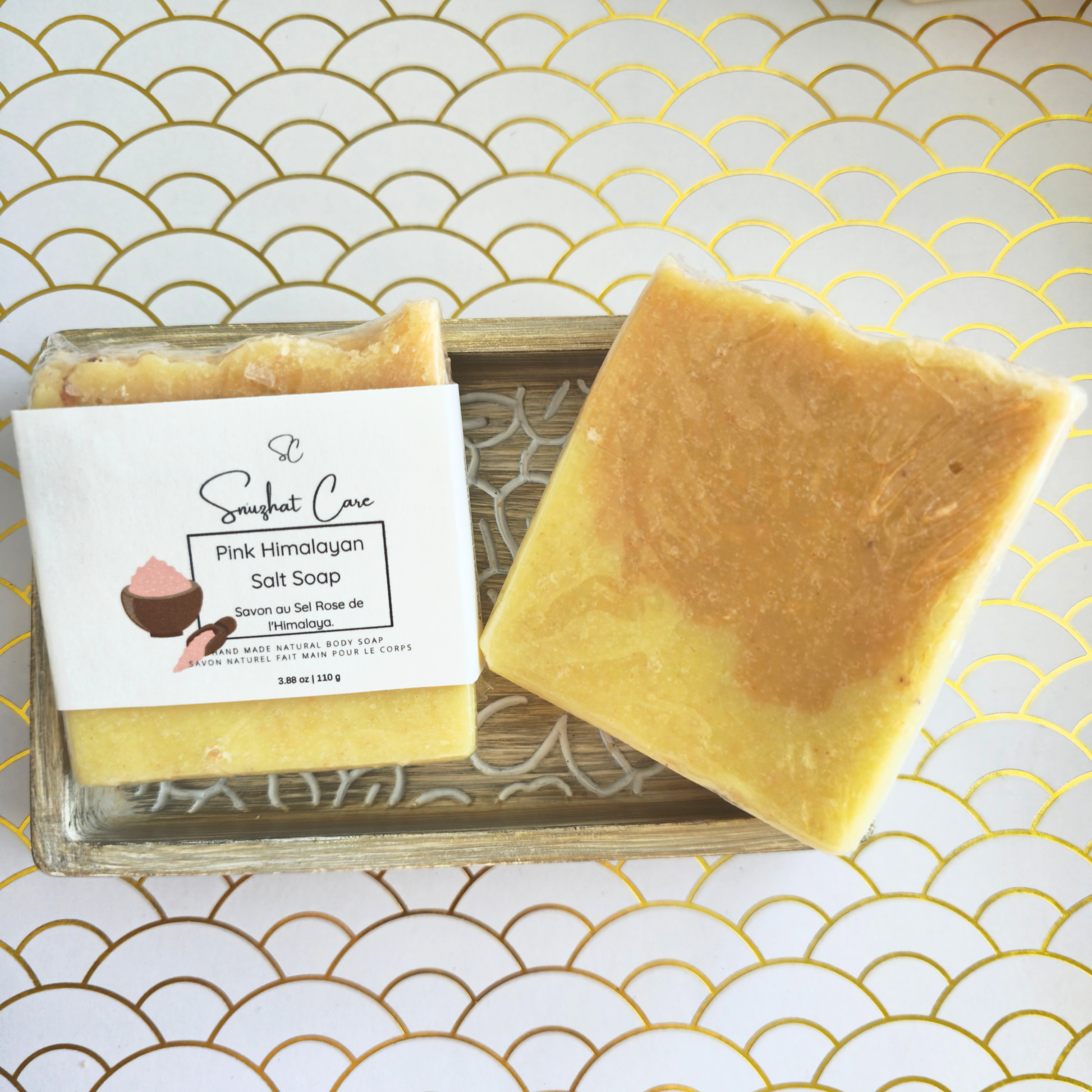 Handmade pink Himalayan salt soap bar with shea butter, avocado oil and kaolin clay for gentle exfoliating botanical skincare by Snuzhat Care