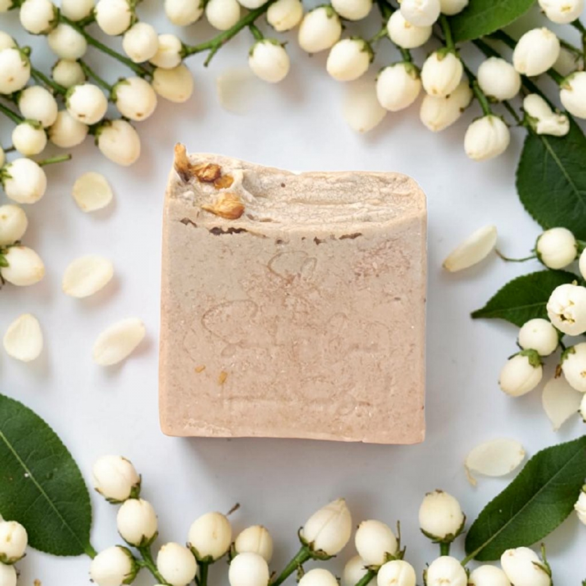 Handmade jasmine soap bar with shea butter, kaolin clay and botanical oils for luxurious floral skincare and self-care rituals by Snuzhat Care