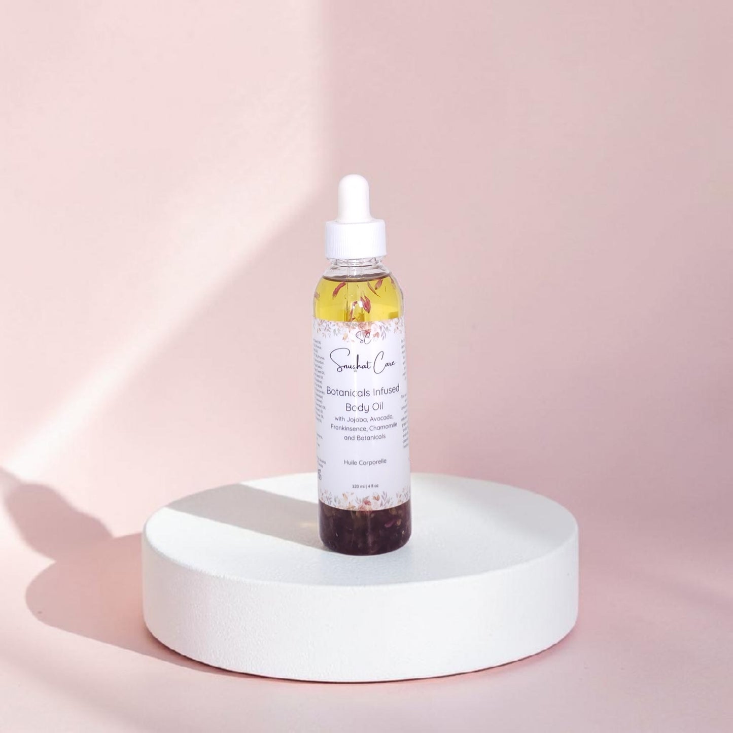 Luxury botanical body oil with squalane, jojoba oil, floral botanicals and essential oils for radiant hydrated skin and spa self-care rituals by Snuzhat Care